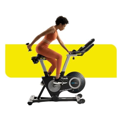 NordicTrack Studio bike 1000 Exercise Bike by The Fitness Factory with 10” HD Touchscreen and 22 digital resistance levels and Two 3 lb dumbbells for home workout on indoor stationary bike, 30 Day iFIT Membership - Black