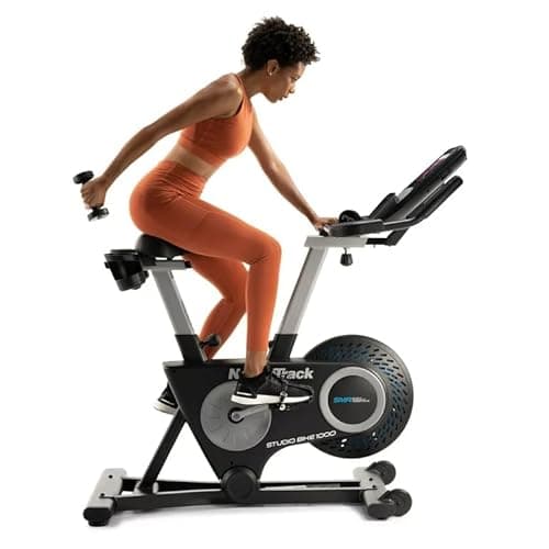 NordicTrack Studio bike 1000 Exercise Bike with 10” HD Touchscreen and 22 digital resistance levels and Two 3 lb dumbbells for home workout on indoor stationary bike, 30 Day iFIT Membership - Black